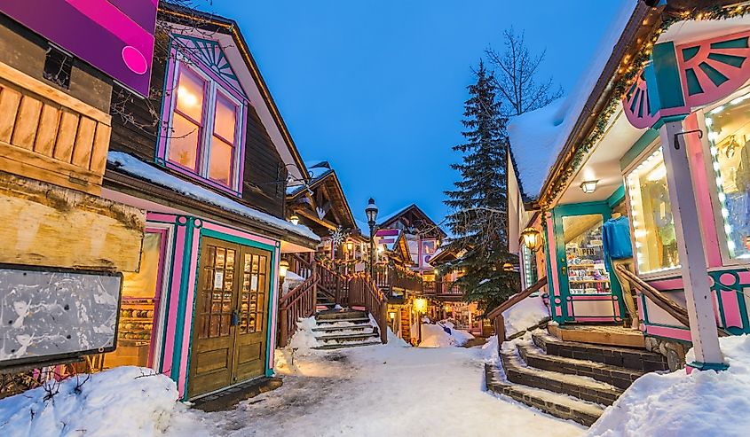 Breckenridge, Colorado, USA downtown streets at night in the winter with holiday lighting.