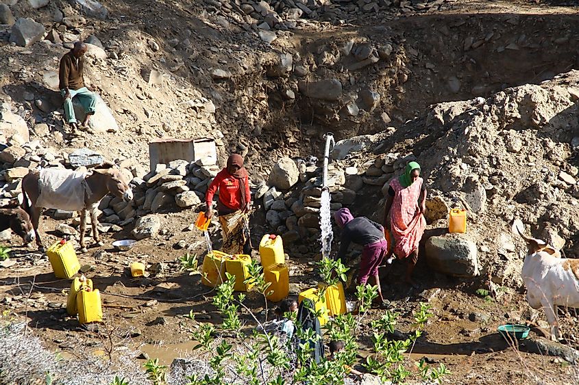 eople harvesting water in alighede river bed, between Asmara and Nefasit