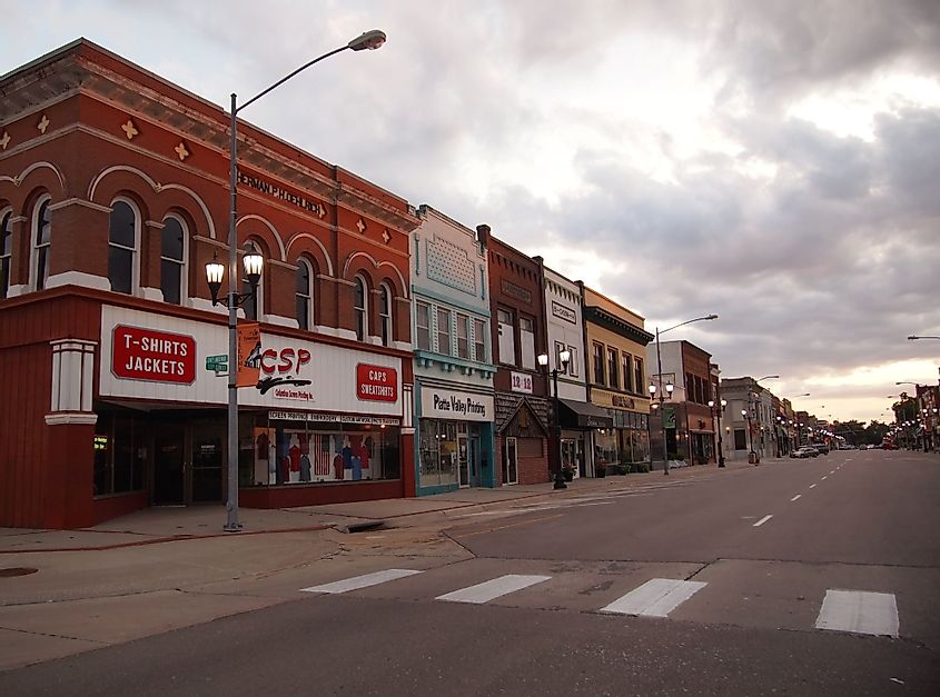 A long street scene with businesses in downtown Columbus, Nebraska