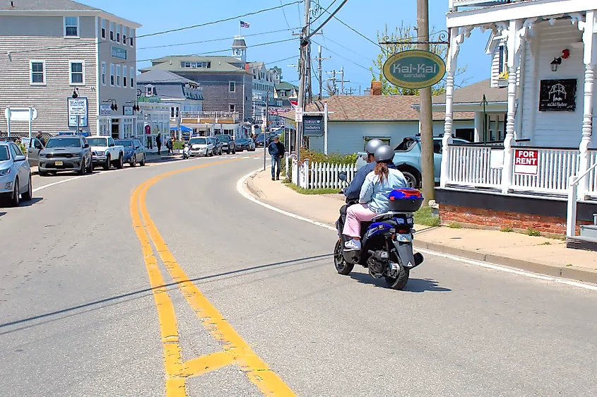 Moped driver and passenger navigating the roads of New Shoreham