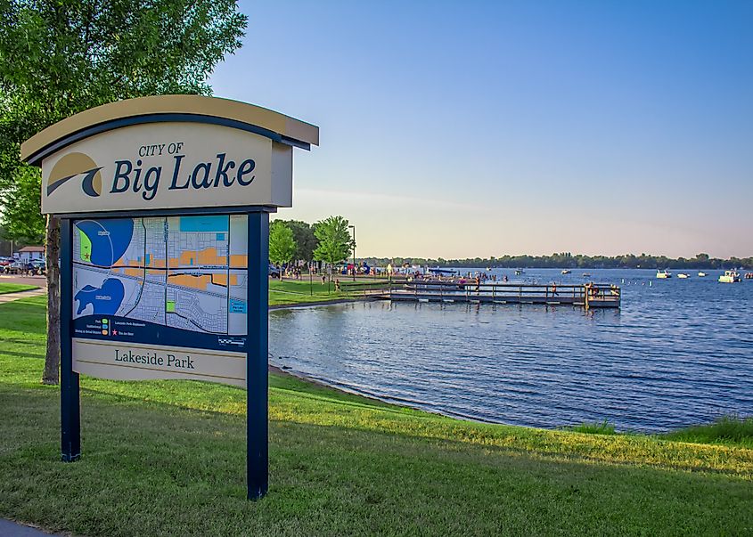 Lakeside Park in Big Lake, featuring open green space, trees, walking paths, and views of the nearby lake shoreline