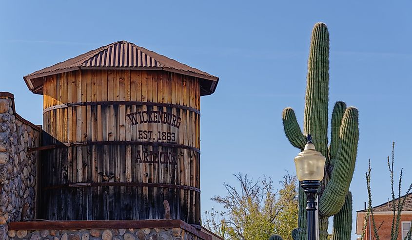 Old fashioned imitation water tower with the town name and Est 1863 is on top of a building on Tegner Street.