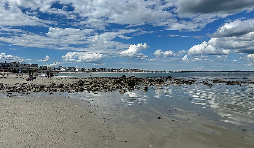 Rock and sand of Wells Beach, Maine.