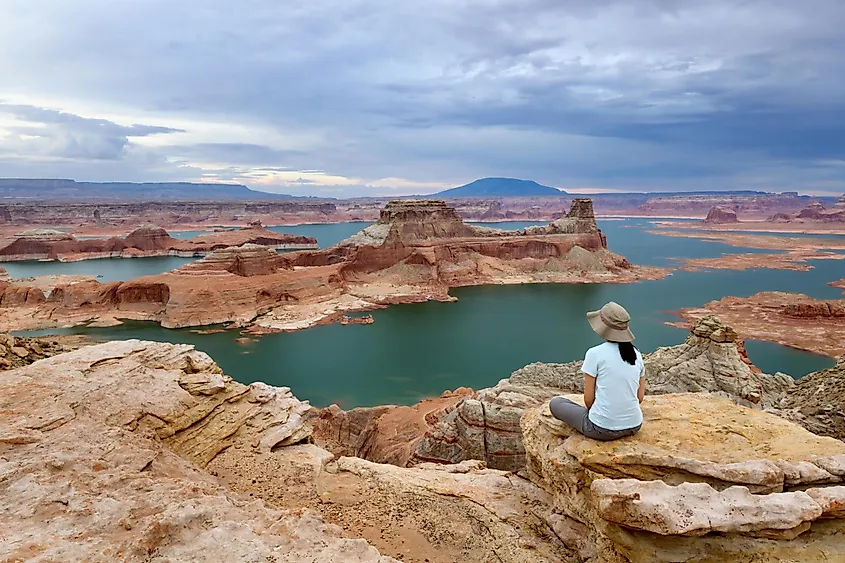 Flooded sandstone canyons of Lake Powell with low water exposing pale canyon walls.
