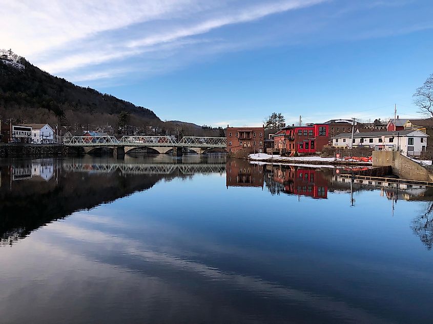 View of Iron Bridge, Deerfield River, Blue Sky, and Quant Idyllic Buildings from the Buckland Side of Shelburne Falls, Massachusetts