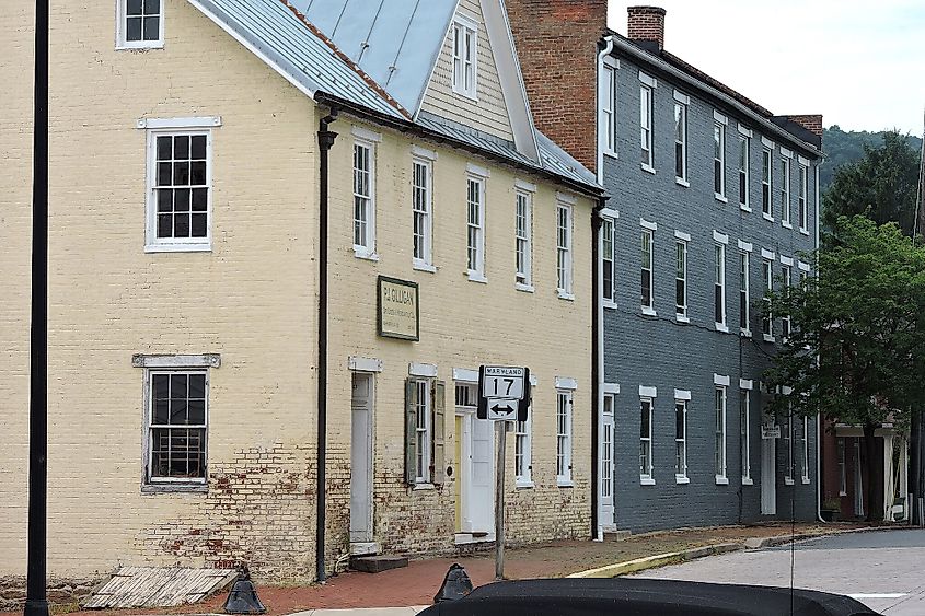 The first building on the left is PJ Gillian's Dry Goods store, located at 2 West Main St.
