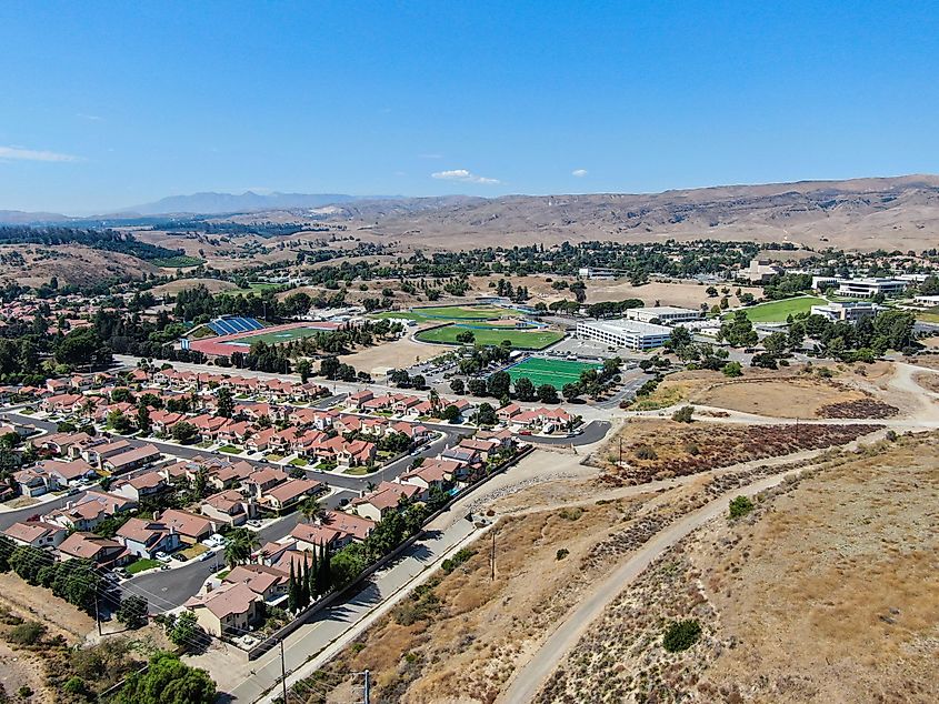 Aerial view of small neighborhood with desert mountain background in Moorpark, Ventura County, Southern California, USA.