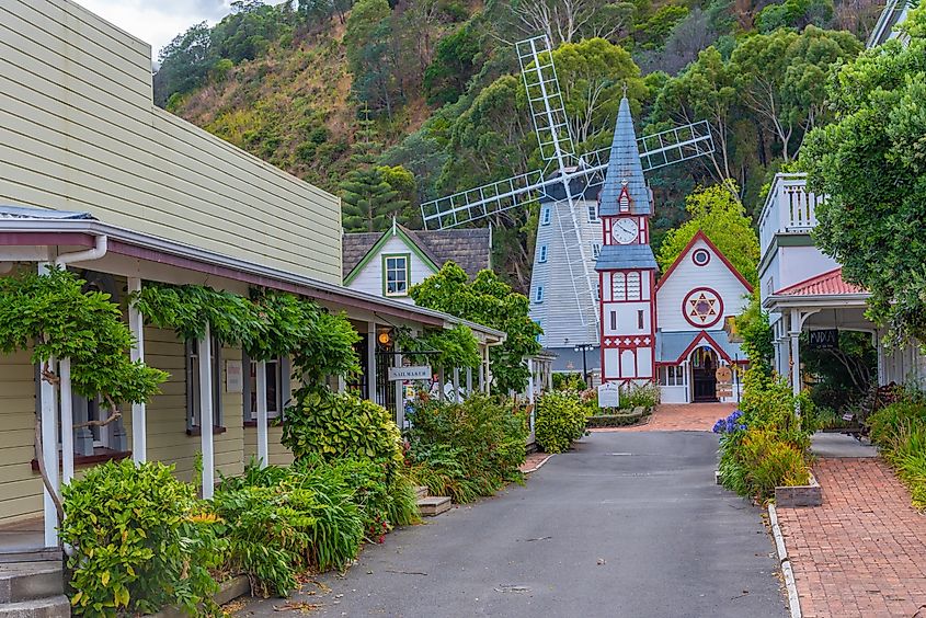 Historical church and windmill at Founders Heritage Park at Nelson, New Zealand.