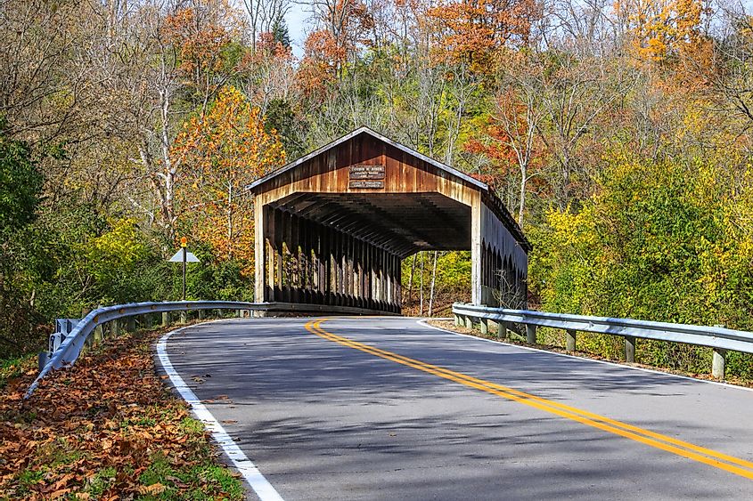 The picturesque Corwin M. Nixon covered bridge on the Little Miami River on an autumn day at Waynesville, Ohio, USA.