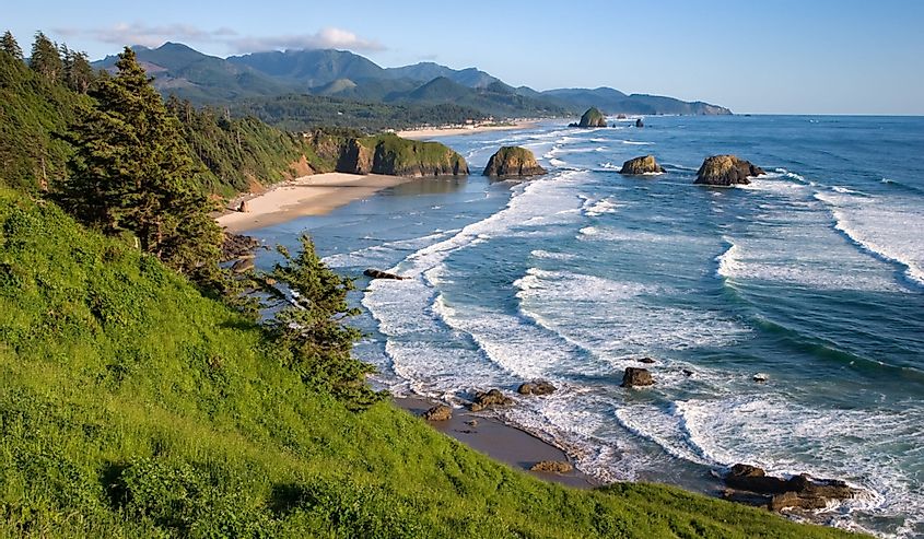 Cannon Beach From Ecola State Park. White cap waves and mountains in the background,