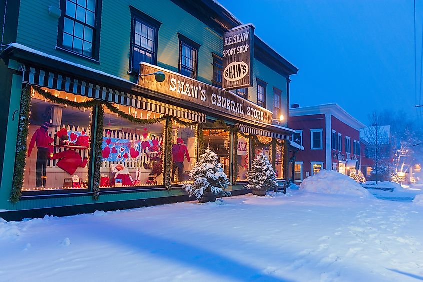 Shaws General Store during a snow covered twilight in Stowe, Vermont