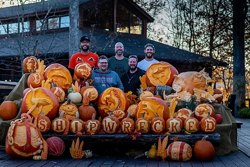 Pumpkin carvers with work at fall festival in West Virginia.