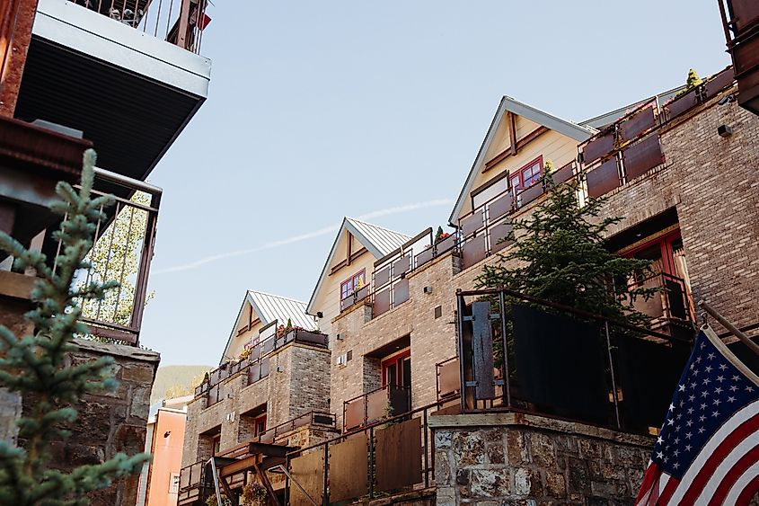 Layered tall brick buildings of condos and apartments in downtown Telluride, Colorado.
