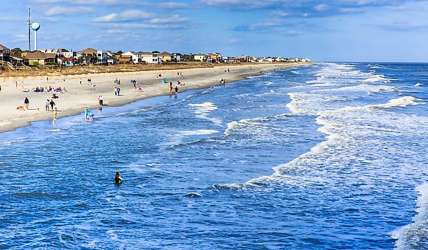 Residents and tourists flock to the Atlantic Ocean at Folly Beach, also known as the "edge of America," near Charleston in South Carolina.