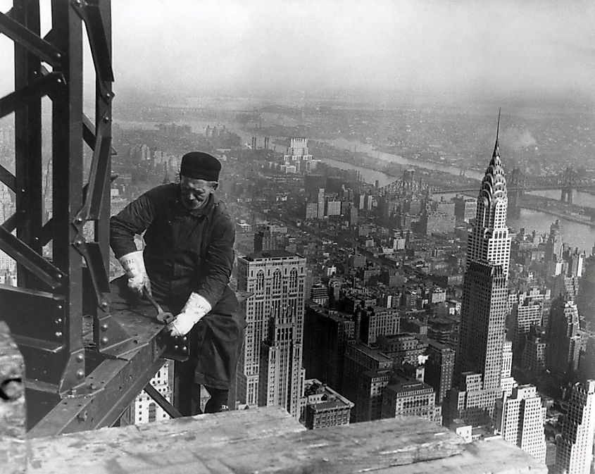 Middle aged iron worker at the Empire State Building construction site, 1930. The Chrysler Building's spire is at right. Photo By Lewis Hine.