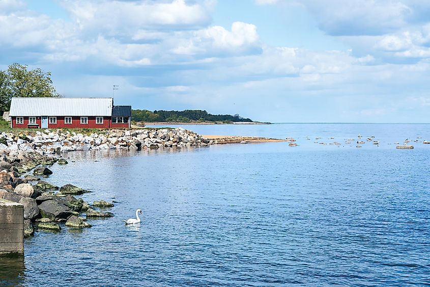 Colourful beach huts along the coast of Simrishamn, Sweden.