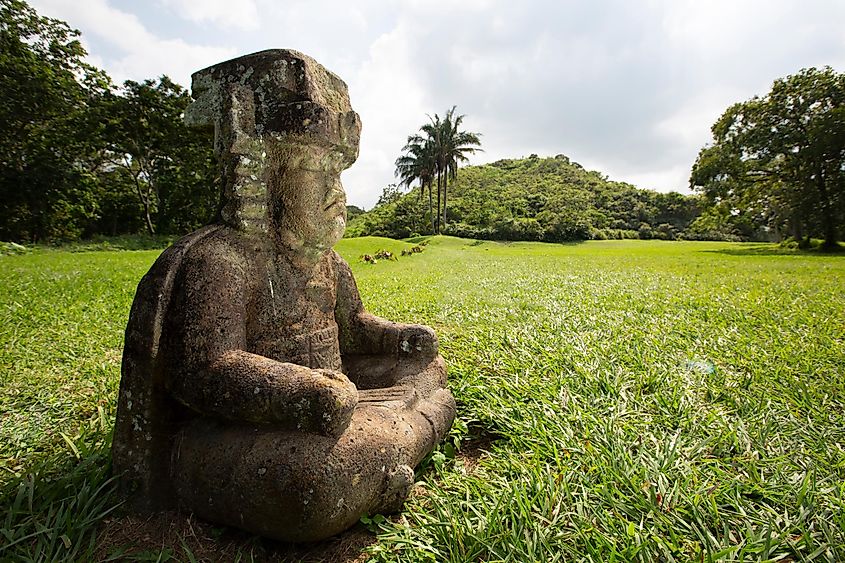 View of an ancient Olmec figure carved out of basalt at the base of the La Venta Pyramid.