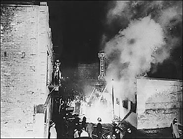 Smoke rises from the Cocoanut Grove.