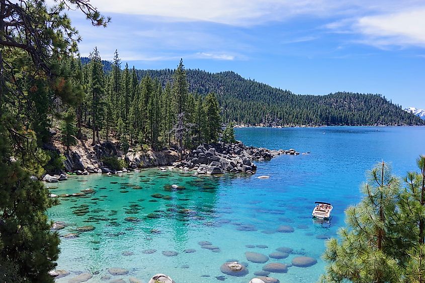 Scenic view of Lake Tahoe from the Nevada side, showcasing the lake's stunning clarity and tranquility on a bright, sunny day.