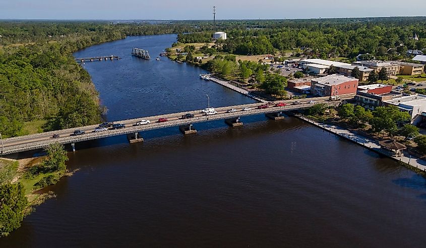 Aerial shot of highway bridge and swing bridge over the wide river at Milton, Florida