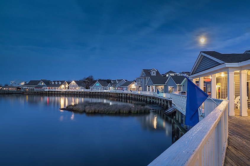 Iconic soundside boardwalk on Currituck Sound under the moonlight in Duck, NC on the Outer Banks.