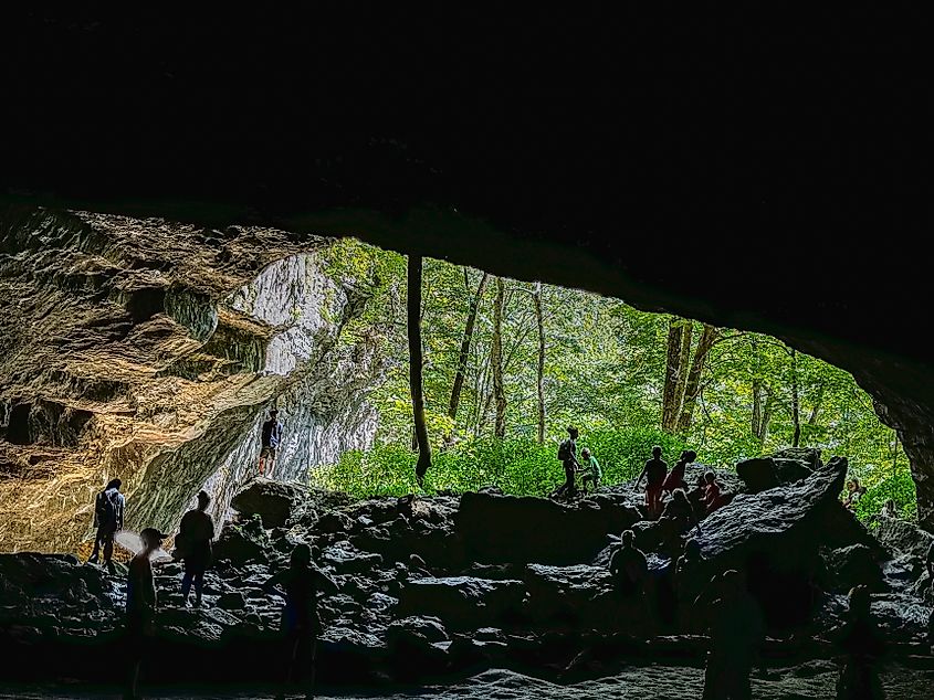 People exploring a cave at the Maquoketa Caves State Park.