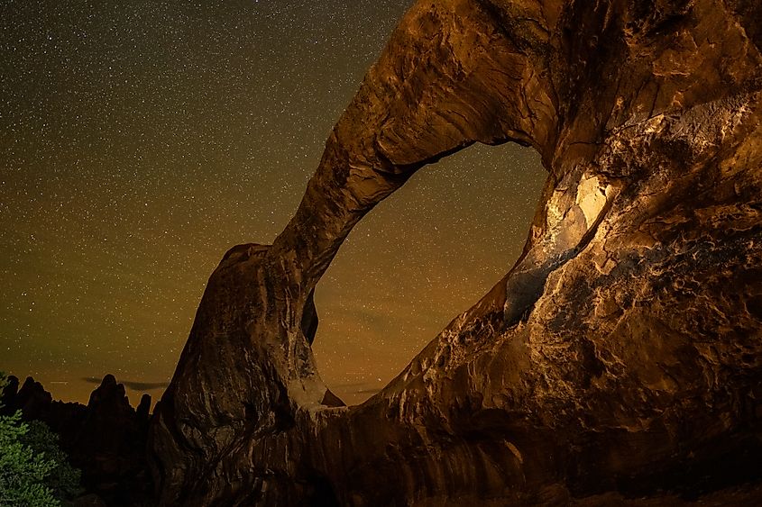 Double O Arch at Night. One of the most beautiful astrophotography locations at Arches National Park in Utah.