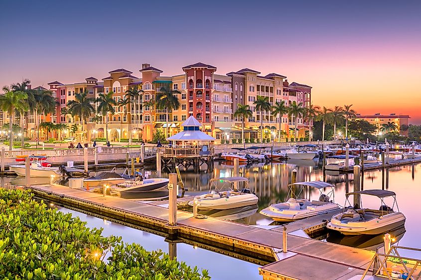 Naples, Florida, USA town skyline on the water at dawn