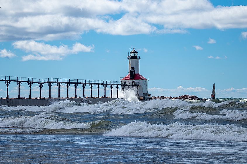 Michigan City Lighthouse on a summer day with high surf in Michigan City, Indiana USA