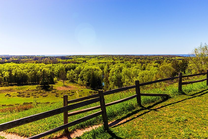 Editorial Photo Credit: Gottography via Shutterstock. Overlook of a Forest at Potawatomi State Park in Sturgeon Bay, Wisconsin. Beautiful Forest at the shore of Lake Michigan in Mid-May in Door County