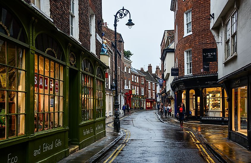 York, United Kingdom: morning view of the High Petergate street in an old town of York, England, with its medieval architecture and small street shops