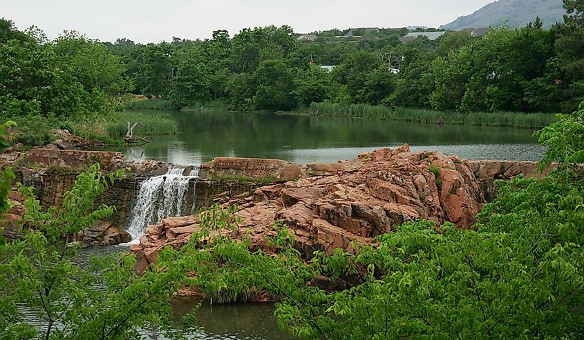 Wide shot of the scenic bath lake with waterfalls at Medicine Park, Oklahoma