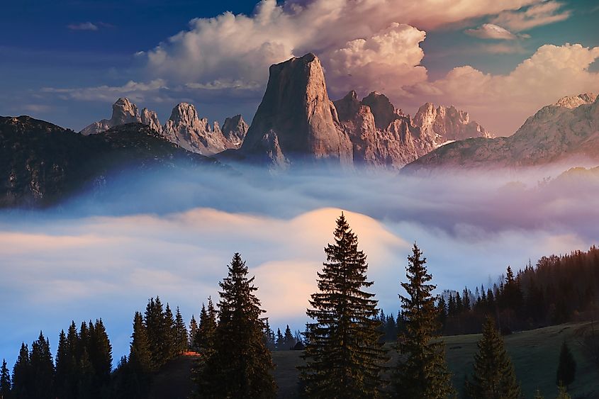 Naranjo de Bulnes known as Picu Urriellu in the foggy morning in Asturias, Spain. Credit: hustieodor / Shutterstock