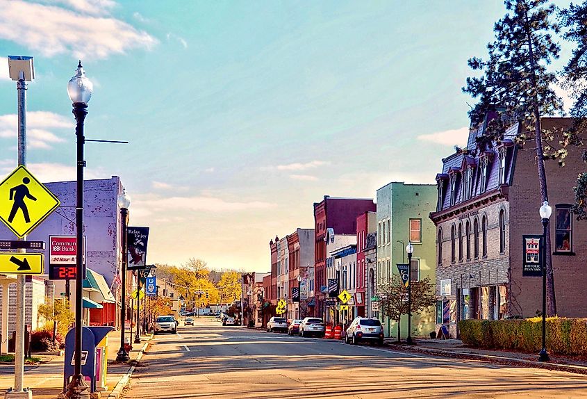 Penn Yan, New York, US- October 31, 2020: Penn Yan Historic District. Sign of ATM from ‘Community Bank’, on the left. Victorian commercial building of Struble’s Arcade on the right.