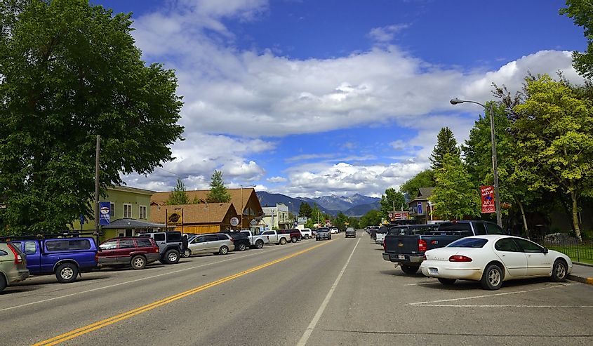 Looking down Main Street in Ennis, Montana with cars angle-parked.