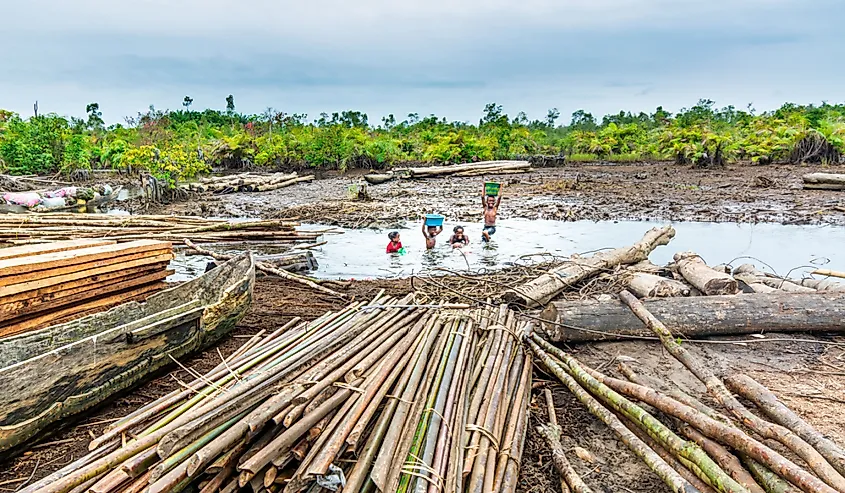 Children bathing and playing in the river, Wamba town, Liberia