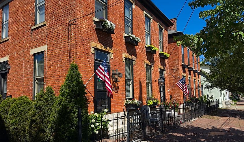 Old residential buildings along brick sidewalks maintain an old world charm in German Village