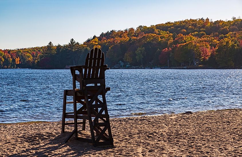 A lifeguard's chair on a beach at Cranberry Lake in Upstate New York, during the autumn season.