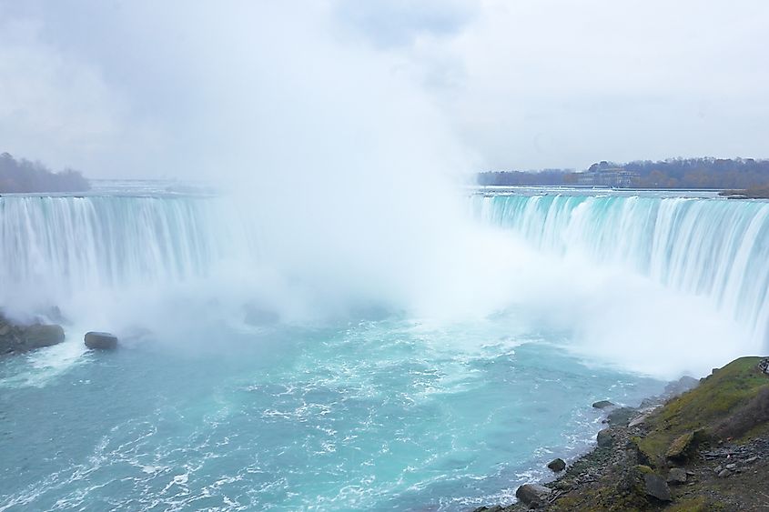 Water pouring over Niagara Falls at high volume.