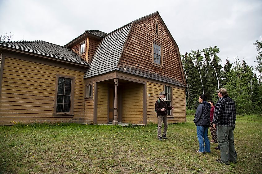 Visitors outside of the non-commissioned officers quarters at Fort Egbert.