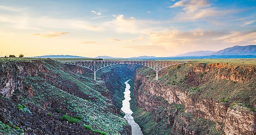 Taos, New Mexico, USA at Rio Grande Gorge Bridge over the Rio Grande at dusk.