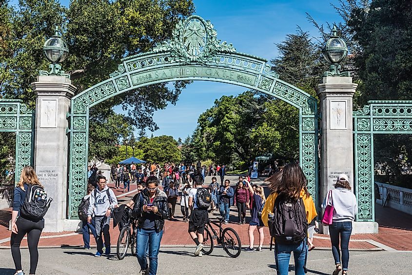 Students pass through Sather Gate, a landmark built in 1910, connecting Sproul Plaza to the center of the college campus at University of Berkeley, California.