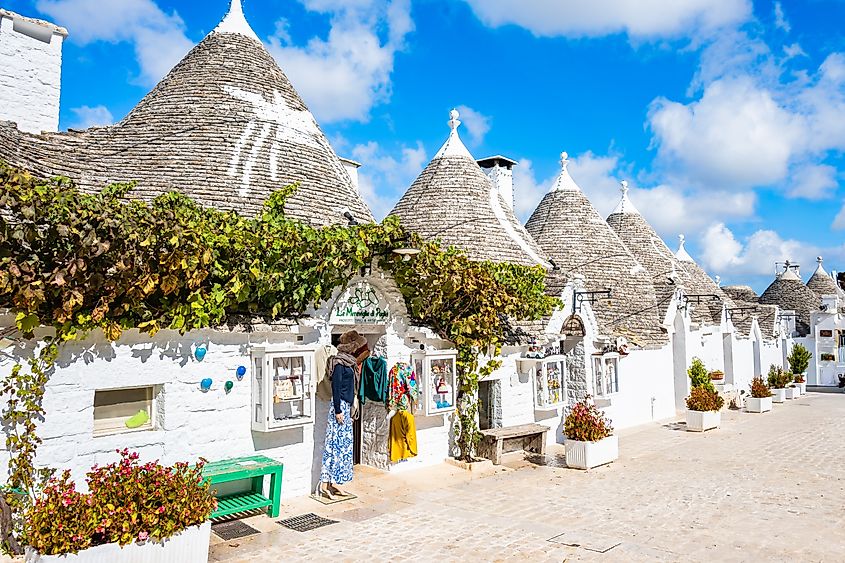 Row of iconic trulli homes in Alberobello, Italy