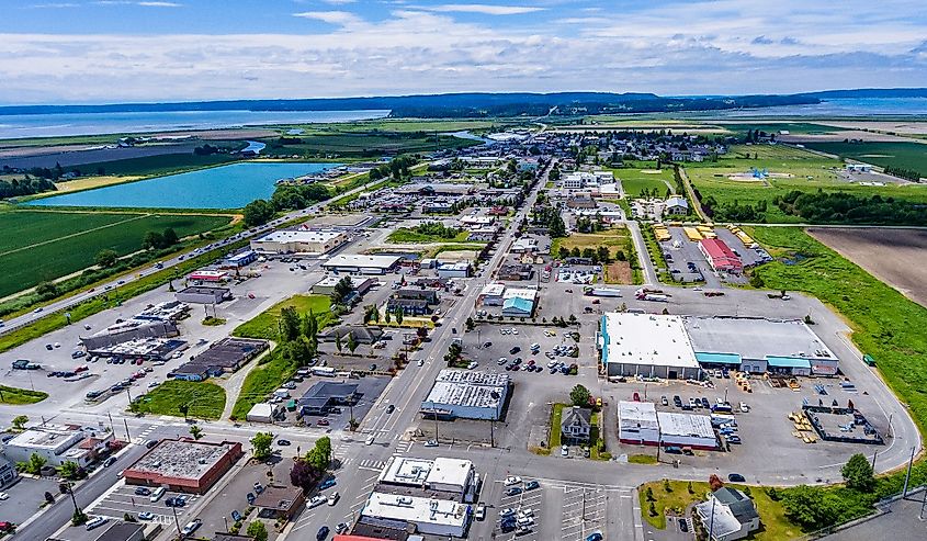 Aerial view of the cityscape of Stanwood with a view of Camano Island in the distance, Washington.