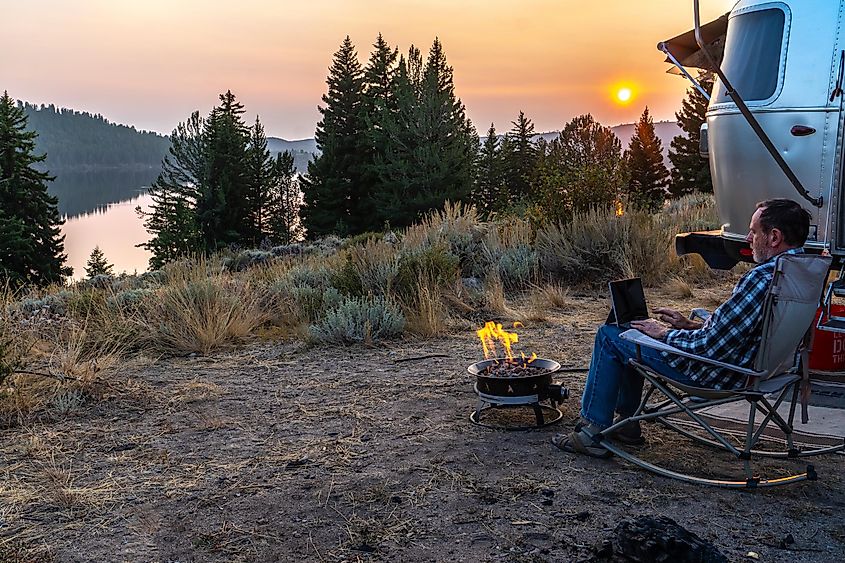 Man sitting next to RV in Pinedale