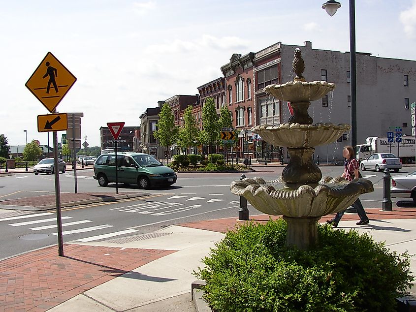 Centennial Circle roundabout in downtown Glens Falls, New York, with sidewalk fountain in foreground