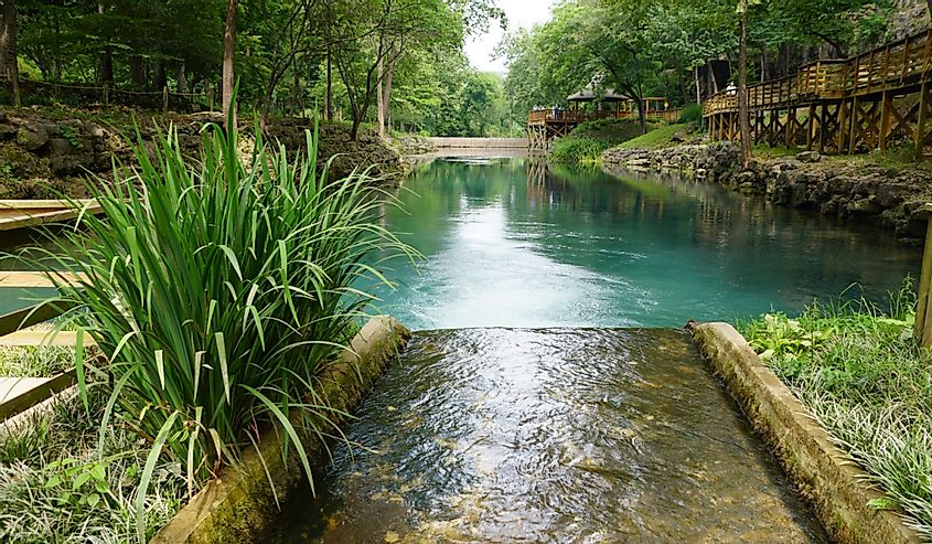 Beautiful landscape and blue water of a natural spring near Blue Spring Heritage Center, Eureka Springs, Arkansas