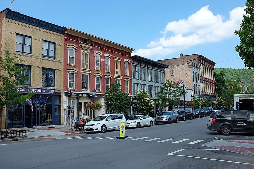 Main Street lined with colorful buildings in Cooperstown, New York