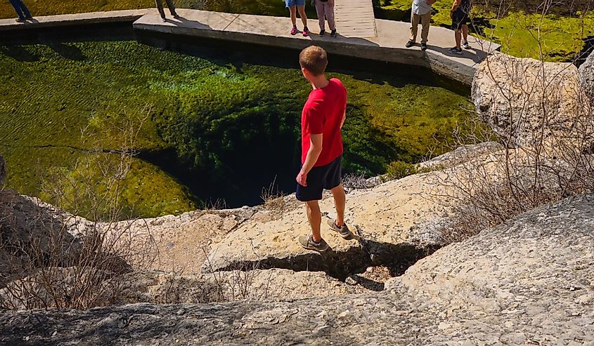 Hiker at Jacob’s Well in Wimberley, Texas