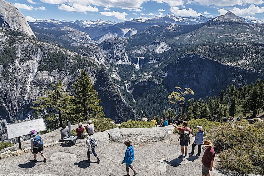 People enjoying the view of Nevada and Vernal falls, at Glacier Point.